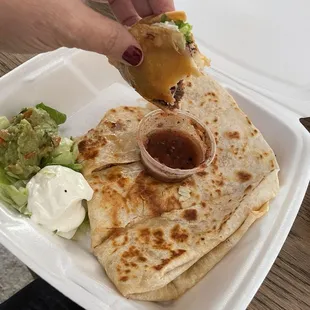Shredded beef taco and salsa. That's the last bite pictured. And their chicken quesadilla. Yum.