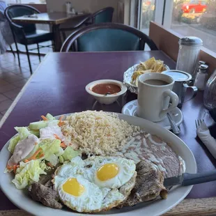 #14 Bistec Montado, top sirloin topped with 2 fried eggs, rice and beans