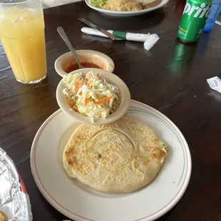 Vegetable papusa with vinegar salad coleslaw thing