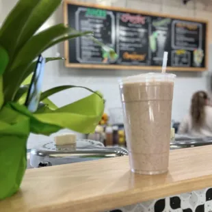 Banana, peanut butter, dates, cinnamon, honey and oat milk smoothie