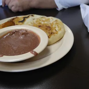 Pupusa special #2 comes with 2 pupusas, fried banana/yuca and blended refried beans and garnish for the pupusas.