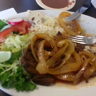 Bistec Encebollado: Came with rice, salad, refried beans, 2 handmade tortillas, and a big piece of meat for only $8 something.