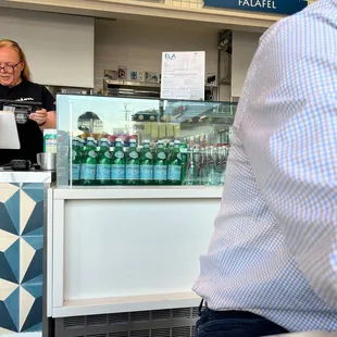 a woman behind a counter