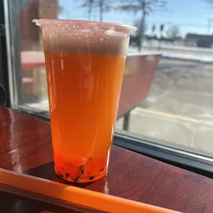 Mango bubble tea with passion fruit boba