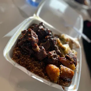 Oxtails over Rice and Beans w/ Steamed Cabbage