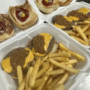 2 Cheese Burger specials W/ chili ketchup,mustard, onions, and relish