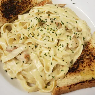 a plate of pasta and toast