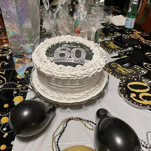 a birthday cake and balloons
