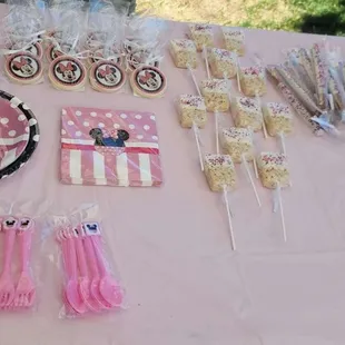 a table with pink and white decorations