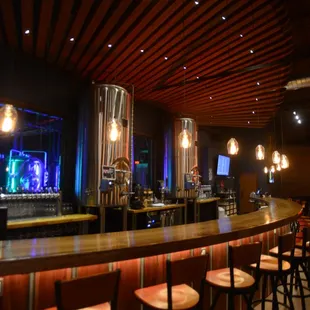 Our beautifully curved, upcycled wood bar