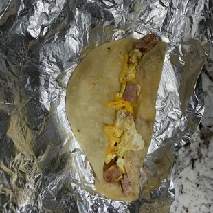 Sausage and Eggs Taco Breakfast - added cheese - they used link sausage cut up not pan sausage