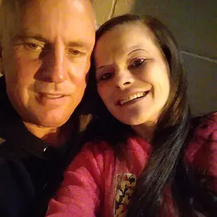 a man and a woman taking a selfie