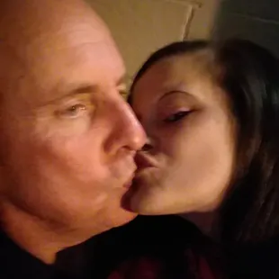 a man and a woman kissing