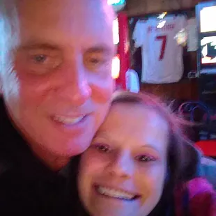 a man and a woman in a bar