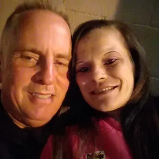 a man and a woman posing for a picture