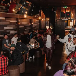 a large group of people at a bar