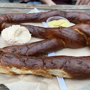 Pretzel with mustard and beer cream cheese