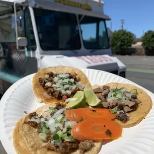 Clockwise from bottom: trio of asada, pastor, and lengua tacos. Not bad, good value