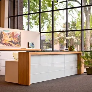 The front desk reflects the contemporary style of the gallery's collection of art.