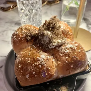 Hot rolls with flakey salt, truffle butter, shaved black truffle