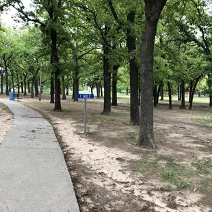 Distance markers for the sidewalk trail around the park.