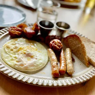 Two Egg Breakfast with Sausage, Smashed Potatoes and Sour Dough Toast