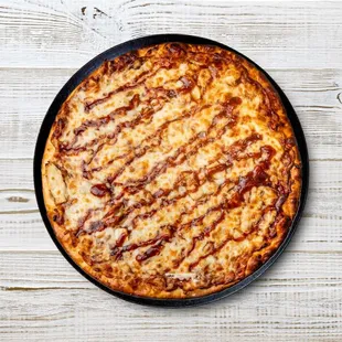 Savor the perfect blend of tangy BBQ sauce, grilled chicken, and melty mozzarella on our BBQ Chicken Pizza. It's a mouthwatering delight tha