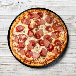 Indulge in a carnivore's delight with our Meat Lovers Pizza. Loaded with pepperoni, sausage, beef, Canadian bacon, and melted mozzarella, it