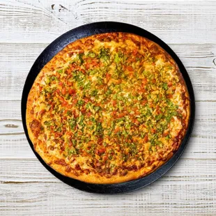 Embark on a flavor-filled adventure with our Taco Pizza. Bursting with taco seasoning, lettuce, juicy tomatoes, and a blend of cheddar and m