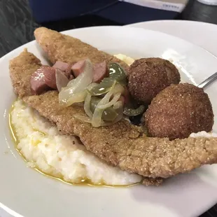 Fish and grits with two hush puppies