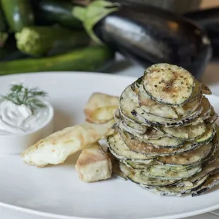ELÉA CHIPS
lightly fried zucchini &amp; eggplant, tzatziki,
kefalograviera cheese