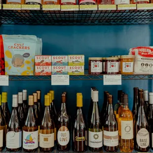 a shelf full of wine bottles