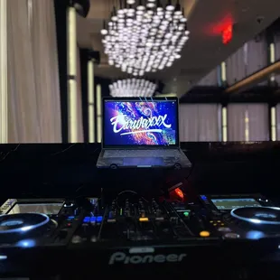 a laptop and dj equipment