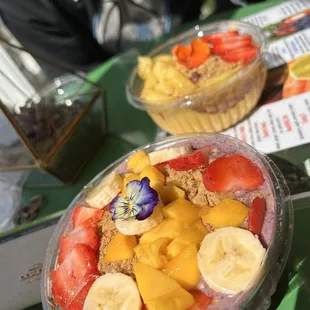 a bowl of fruit and a cup of yogurt