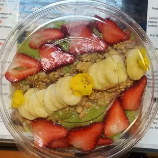 strawberries, bananas, kiwis, and strawberries in a bowl