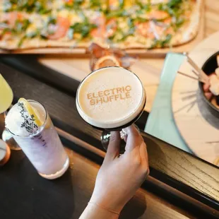 a person holding a cup of coffee