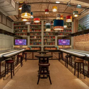 a row of bowling tables in a bowling alley