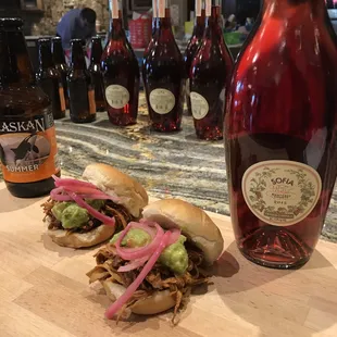 a bottle of wine and a sandwich