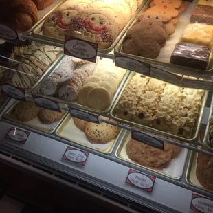 a variety of baked goods in a display case