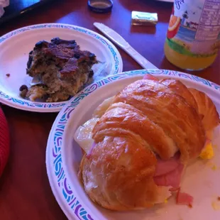 Egg,Swiss and ham on a croissant, blueberry scone