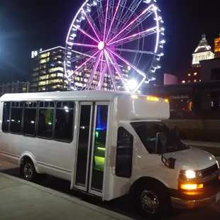This is our new white party bus named Casper. Obviously downtown Cincinnati in front of the SkyWheel