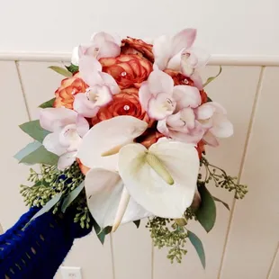 Beautiful bridal bouquet, circus roses, white anthuriums, white hydrangea (not really visible), &amp; pink cymbidium orchids