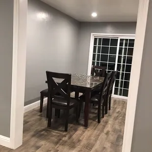 Upgraded chairs &amp; bench with marble top dining table.