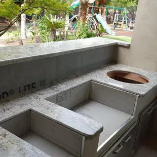 outdoor kitchen with sink and grill