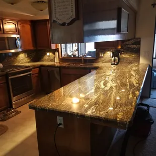 a kitchen with granite counter tops