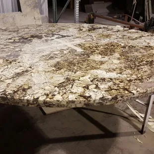 a marbled table in a warehouse