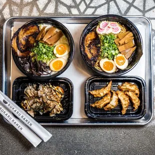 a tray of asian food