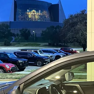 Church of the Resurrection stained glass shines at night, visible from hotel front door