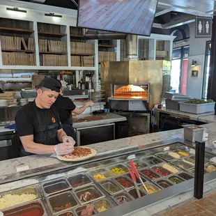 a man preparing food in a restaurant kitchen