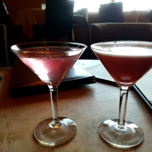 two glasses of wine on a table